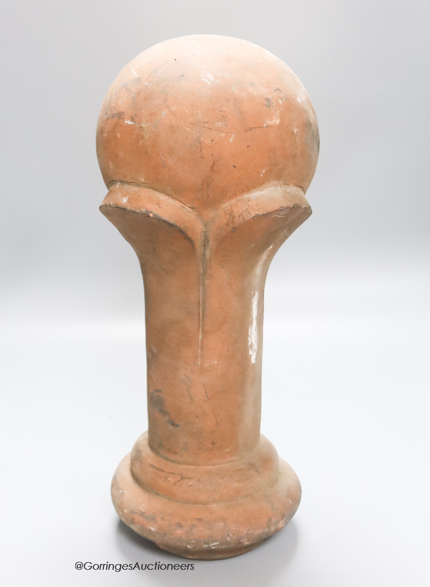 A terracotta finial, height 38cm